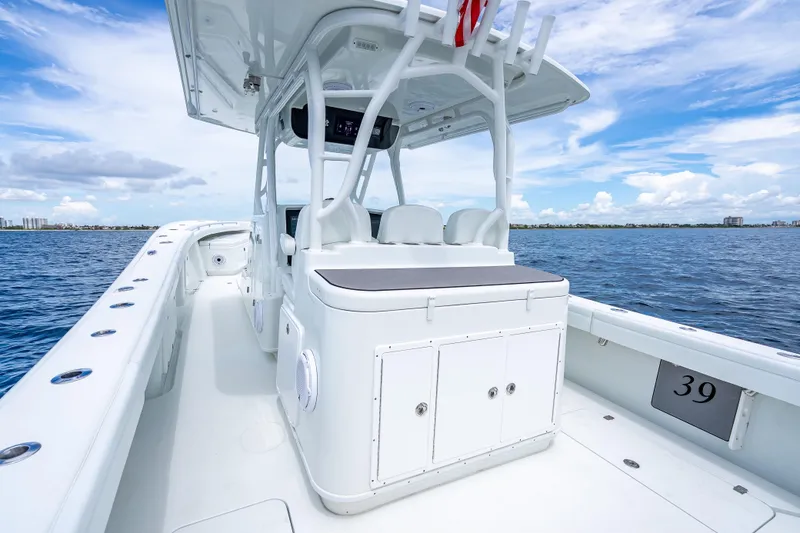 Slide: The Image of 2016 Yellowfin 39 Offshore boat on open water, showcasing sleek design and spacious deck. - 33