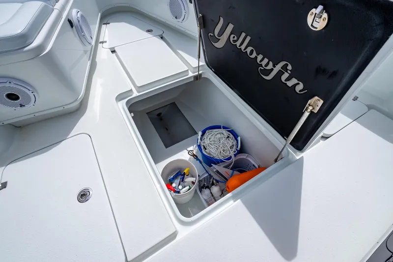 Slide: The Image of 2016 Yellowfin 39 Offshore boat storage compartment with fishing gear and accessories. - 50