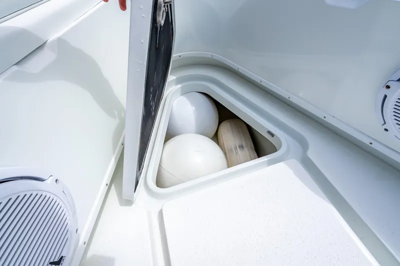 Slide: The Image of Storage compartment on 2016 Yellowfin 39 Offshore boat with fenders inside. - 47