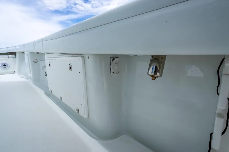 Slide: The Image of 2016 Yellowfin 39 Offshore boat interior detail with storage compartment and fixtures. - 59