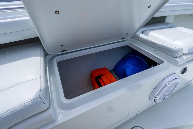 Slide: The Image of Open storage compartment on 2016 Yellowfin 39 Offshore boat with gear inside. - 49