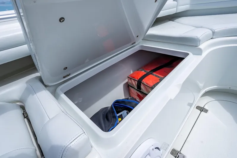 Slide: The Image of Storage compartment on 2016 Yellowfin 39 Offshore boat with life jackets and gear. - 48