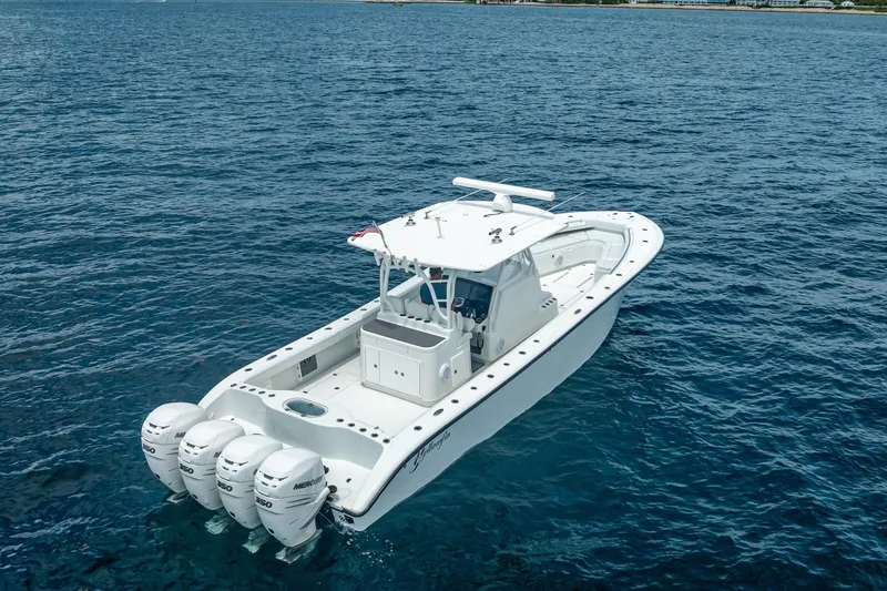 Slide: The Image of 2016 Yellowfin 39 Offshore boat with triple Mercury engines on open water. - 7