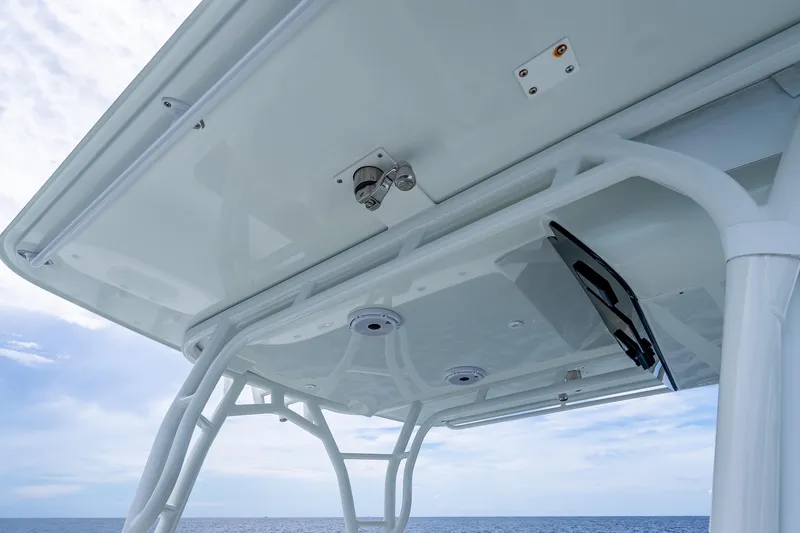 Slide: The Image of 2016 Yellowfin 39 Offshore boat's T-top structure against a clear sky and ocean backdrop. - 28