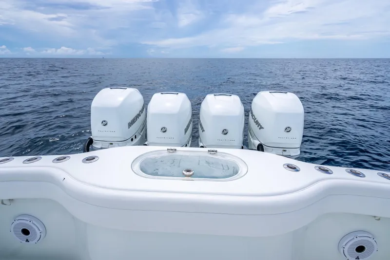 Slide: The Image of 2016 Yellowfin 39 Offshore boat with four Mercury outboard engines on open sea. - 38