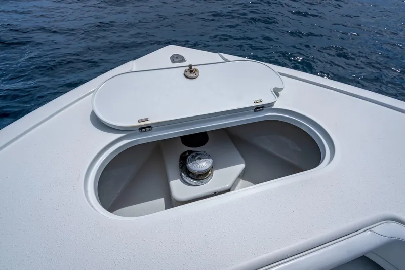 Slide: The Image of Bow storage compartment on a 2016 Yellowfin 39 Offshore boat, open at sea. - 51
