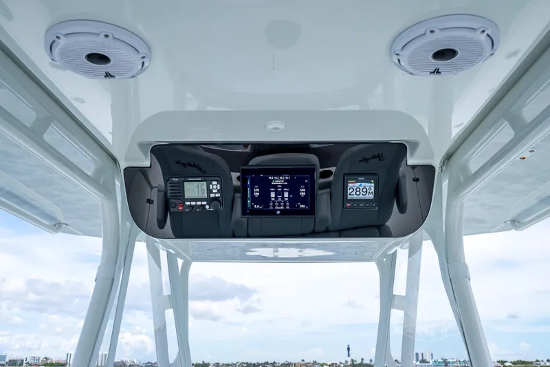 Slide: The Image of 2016 Yellowfin 39 Offshore boat dashboard with advanced navigation and communication systems. - 26
