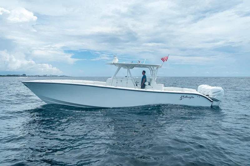 The Image of 2016 Yellowfin 39 Offshore boat cruising on open water under a cloudy sky. - 0