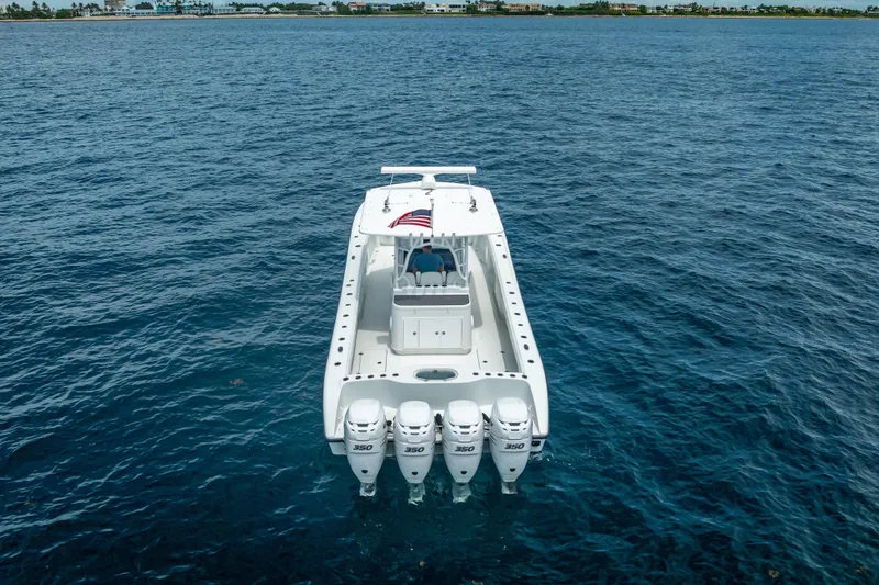Slide: The Image of 2016 Yellowfin 39 Offshore boat with quad 350 engines on open water. - 8