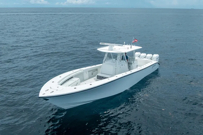 Slide: The Image of 2016 Yellowfin 39 Offshore boat on open sea, featuring sleek design and powerful engines. - 4