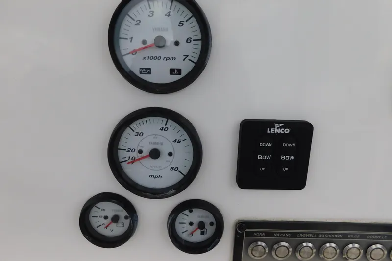 Slide: The Image of Dashboard of a 2017 Tidewater 198 CC Adventure boat with Yamaha gauges and Lenco controls. - 15