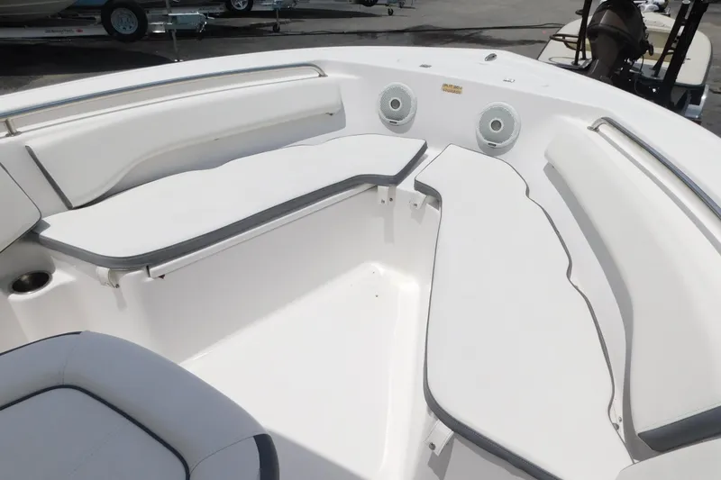Slide: The Image of 2017 Tidewater 198 CC Adventure boat interior with cushioned seating and speakers. - 10