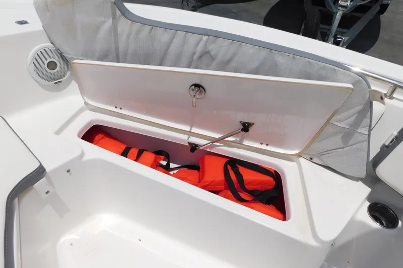 Slide: The Image of Storage compartment with life jackets on a 2017 Tidewater 198 CC Adventure boat. - 21