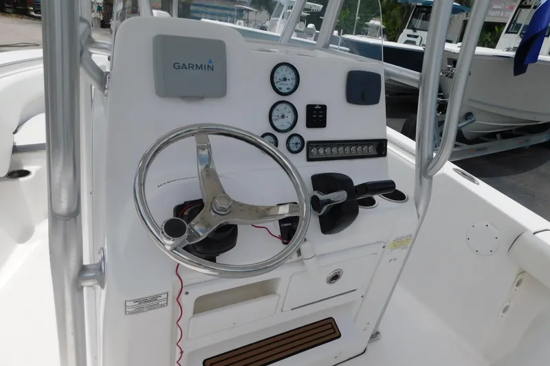 Slide: The Image of 2017 Tidewater 198 CC Adventure boat console with Garmin navigation and steering wheel. - 24