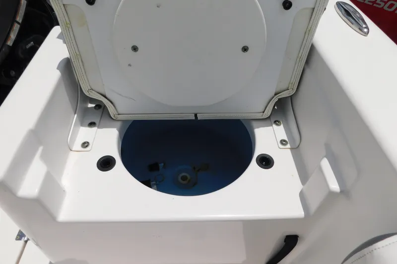Slide: The Image of Open storage compartment on a 2017 Tidewater 198 CC Adventure boat. - 22