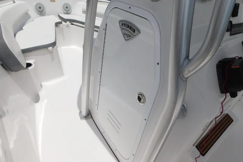 Slide: The Image of 2017 Tidewater 198 CC Adventure boat interior with seating and storage compartment. - 27