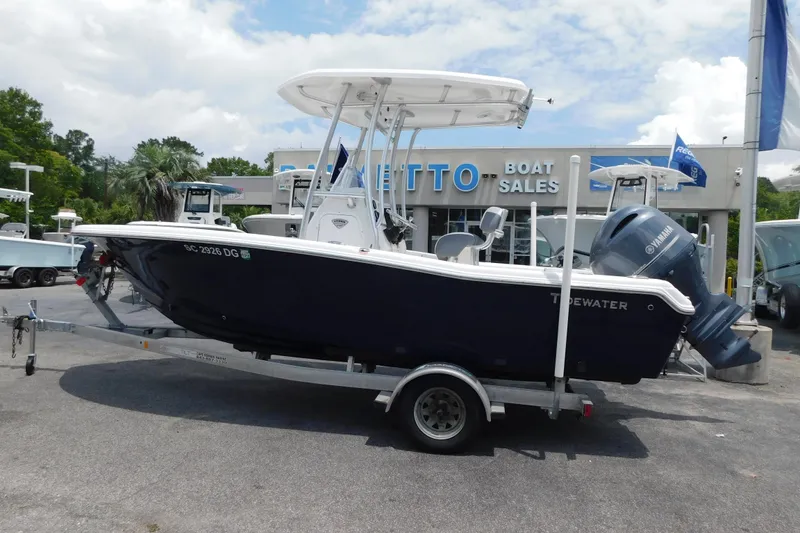 Slide: The Image of 2017 Tidewater 198 CC Adventure boat on trailer at dealership. - 18