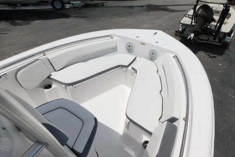 Slide: The Image of 2017 Tidewater 198 CC Adventure boat interior with cushioned seating and speakers. - 7