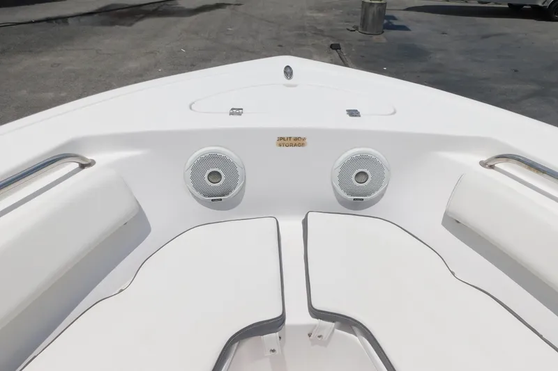 Slide: The Image of Bow seating area of 2017 Tidewater 198 CC Adventure boat with speakers and storage. - 11
