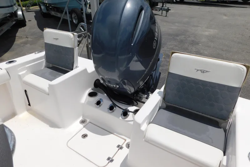 Slide: The Image of 2017 Tidewater 198 CC Adventure boat interior with Yamaha engine and seating. - 6