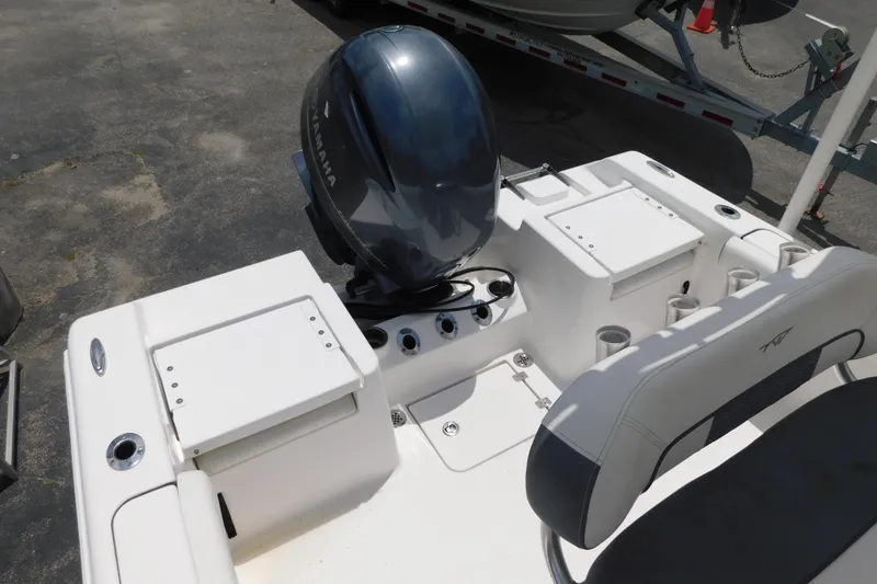 Slide: The Image of 2017 Tidewater 198 CC Adventure boat with Yamaha outboard motor, featuring seating and storage compartments. - 5