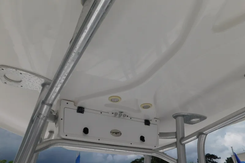 Slide: The Image of 2017 Tidewater 198 CC Adventure boat's T-top structure and ceiling details. - 23