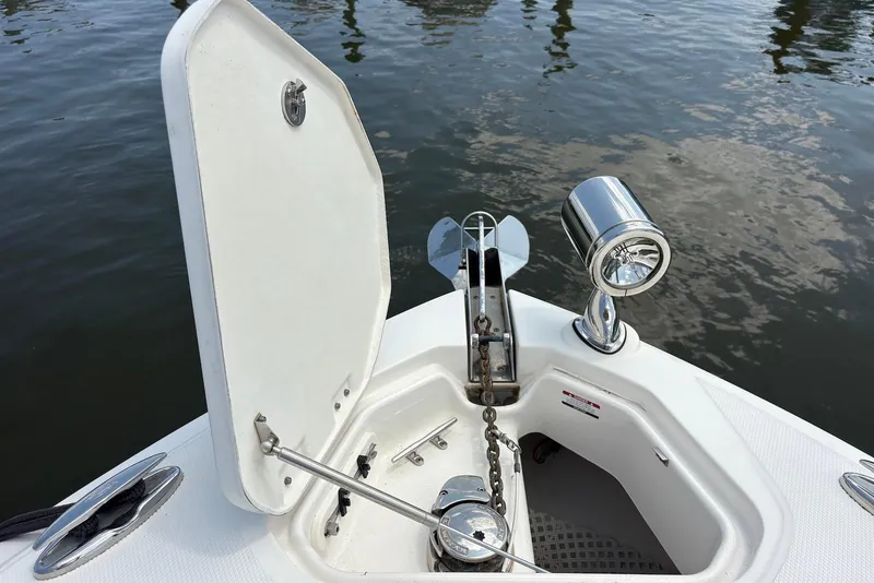 Slide: The Image of Bow anchor compartment of 2013 Chaparral 327 SSX boat with open hatch. - 15