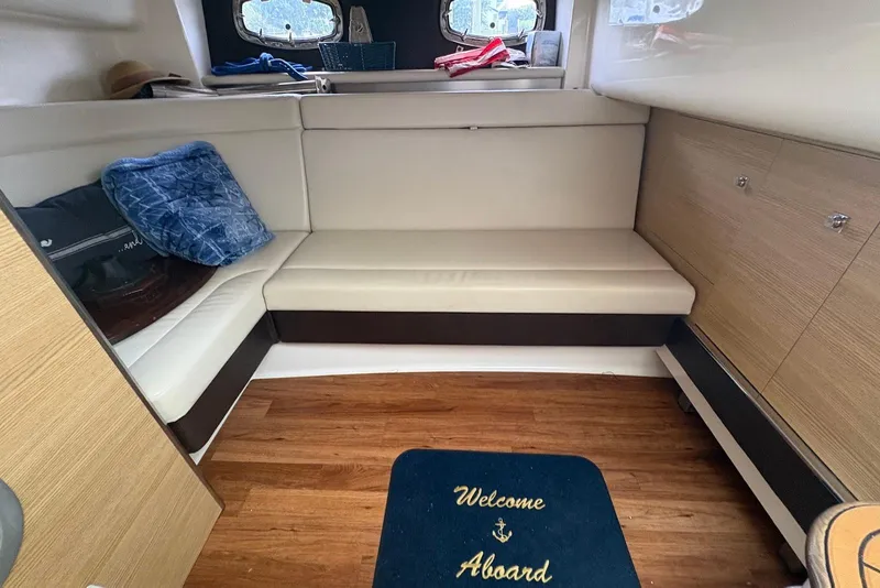 Slide: The Image of Interior of 2013 Chaparral 327 SSX boat with seating and welcome mat. - 17