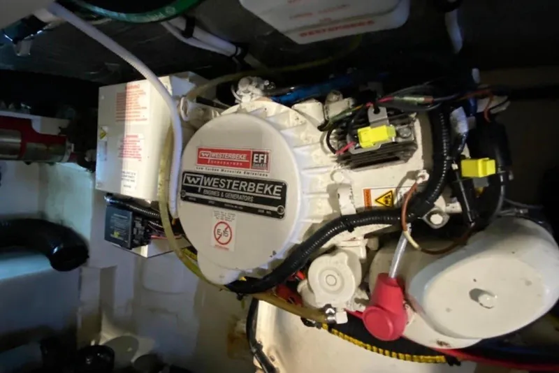 Slide: The Image of Engine compartment of a 2013 Chaparral 327 SSX featuring a Westerbeke generator. - 8