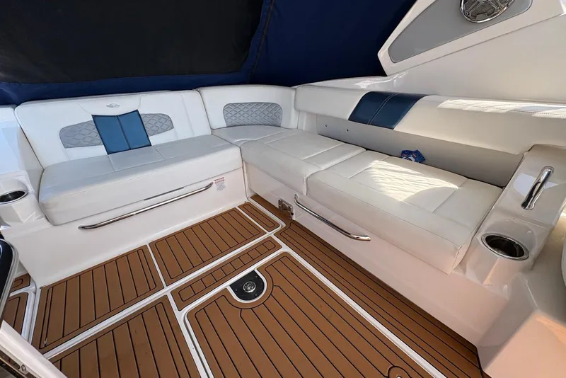 Slide: The Image of Luxurious seating area on 2013 Chaparral 327 SSX boat with teak flooring. - 11