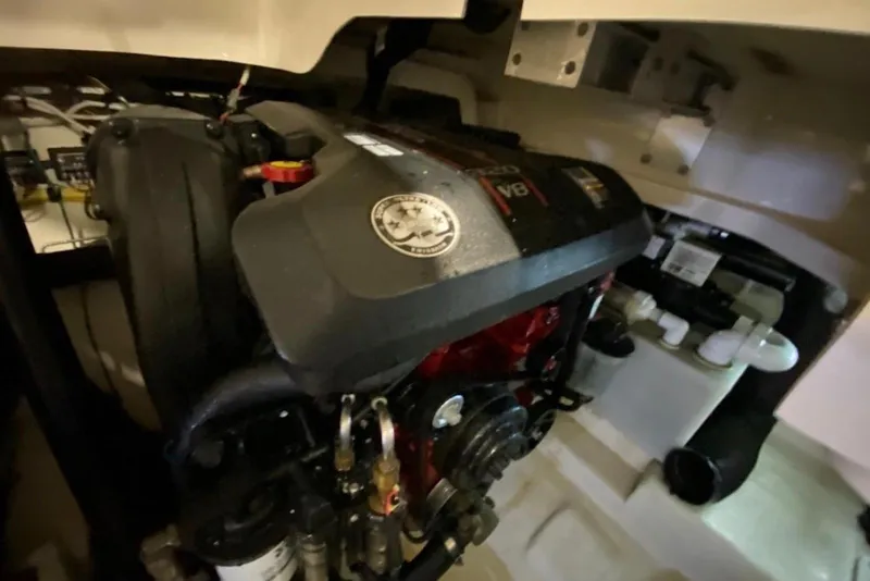 Slide: The Image of Engine compartment of a 2013 Chaparral 327 SSX boat, featuring a powerful V8 engine. - 7