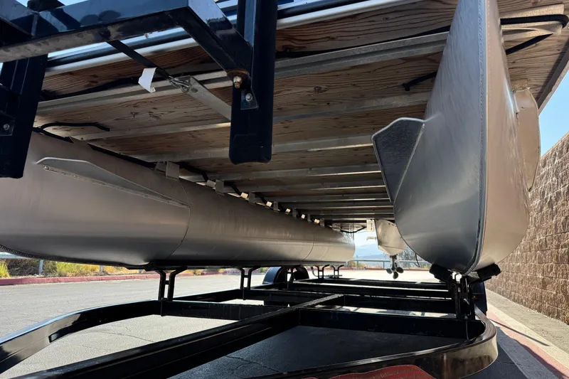 Slide: The Image of Underneath view of a 2014 Bentley Pontoons Encore 240 Cruise on a trailer. - 4