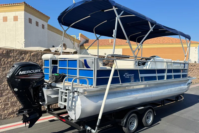 Slide: The Image of 2014 Bentley Pontoons Encore 240 Cruise with Mercury outboard motor on trailer. - 6