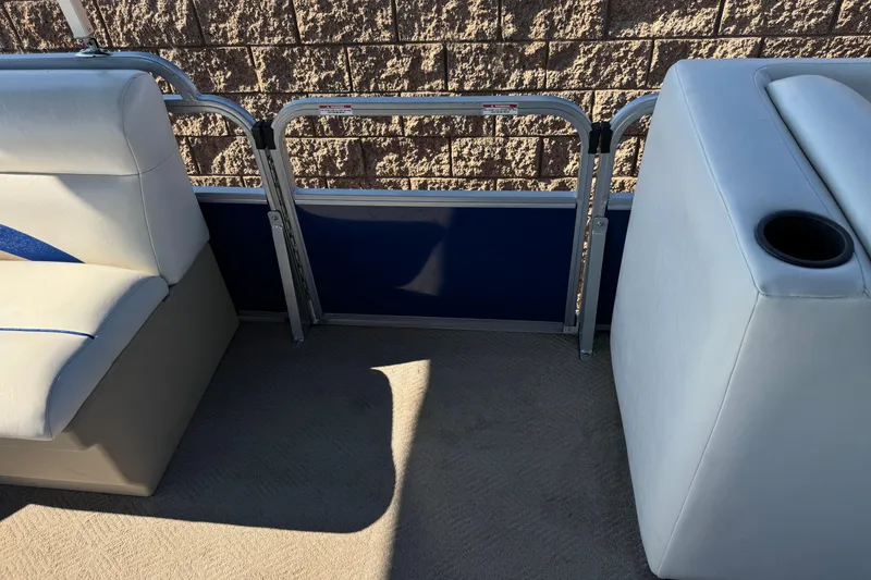 Slide: The Image of 2014 Bentley Pontoons Encore 240 Cruise interior seating with cup holder and railing. - 13
