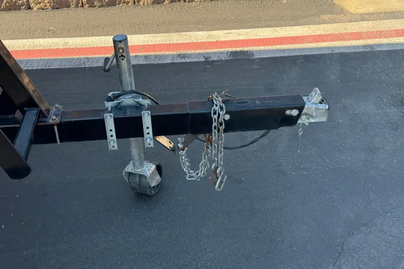 Slide: The Image of Trailer hitch of a 2014 Bentley Pontoons Encore 240 Cruise on asphalt road. - 24