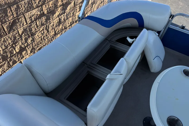 Slide: The Image of 2014 Bentley Pontoons Encore 240 Cruise interior seating and storage compartments. - 12