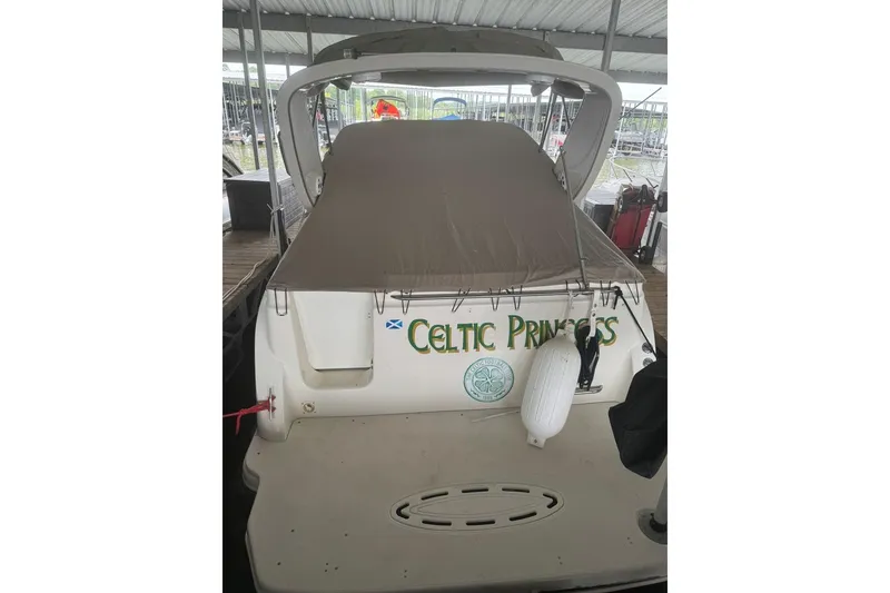 Slide: The Image of 2001 Maxum 2900 SCR boat named "Celtic Princess" docked under a covered marina. - 3