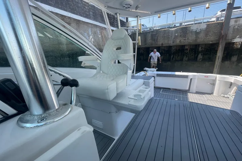 Slide: The Image of 1999 Luhrs 36 SX Open boat interior with helm seat and deck view. - 35