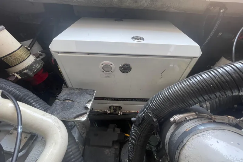 Slide: The Image of Engine compartment of a 1999 Luhrs 36 SX Open boat with Northern Lights generator. - 38