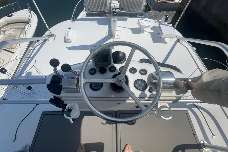 Slide: The Image of Helm of 1999 Luhrs 36 SX Open boat with steering wheel and control panel. - 40