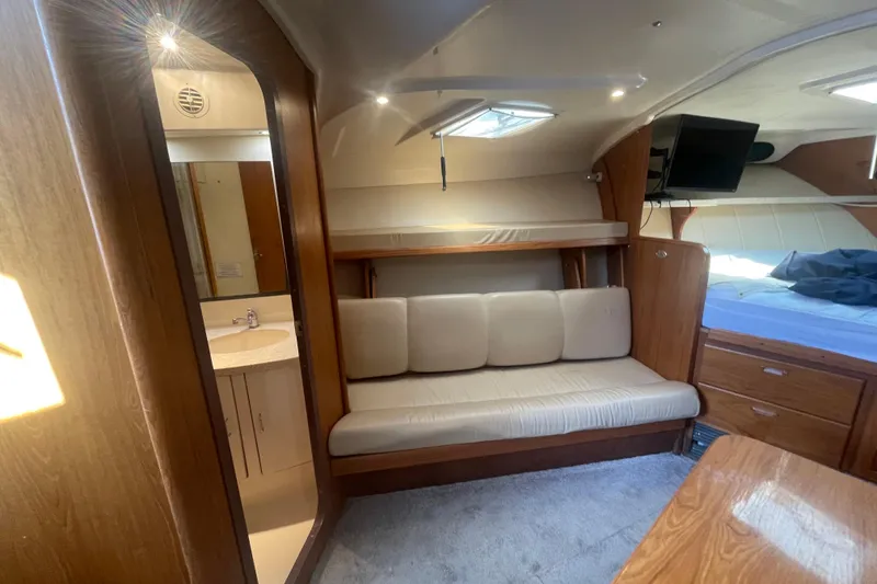Slide: The Image of Interior of 1999 Luhrs 36 SX Open yacht with cozy seating and modern amenities. - 31