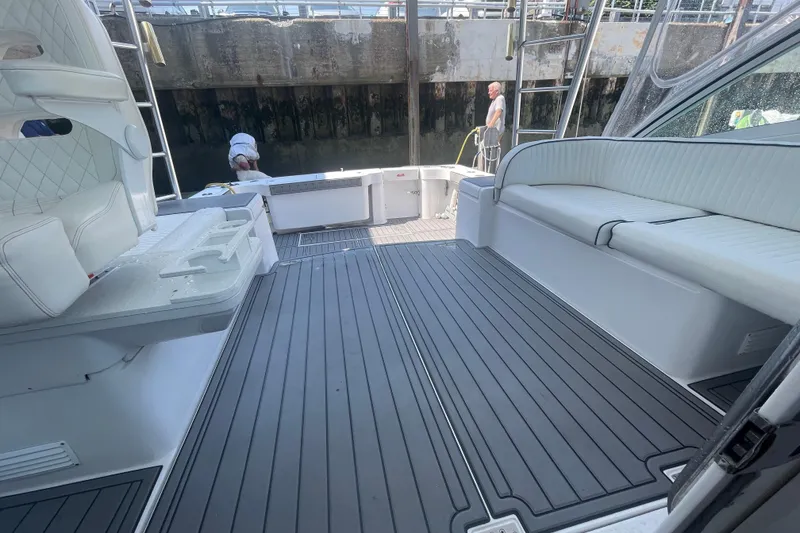 Slide: The Image of 1999 Luhrs 36 SX Open boat interior with sleek seating and modern flooring. - 34