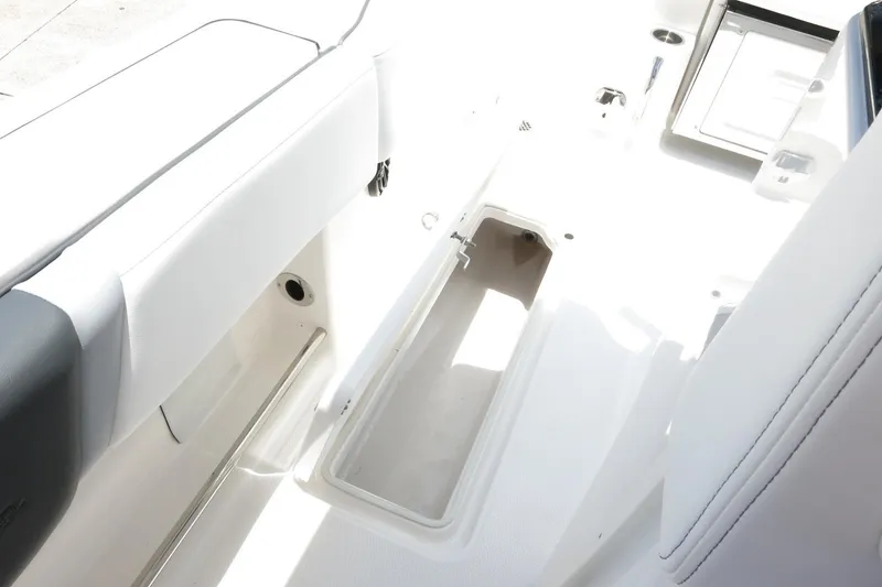 Slide: The Image of 2026 Robalo R270 Center Console boat interior with open storage compartment. - 69