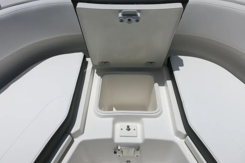 Slide: The Image of Open storage compartment on 2026 Robalo R270 Center Console boat. - 26
