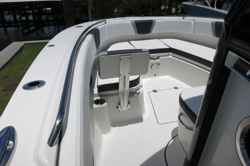 Slide: The Image of 2026 Robalo R270 Center Console boat interior with seating and storage compartments. - 58