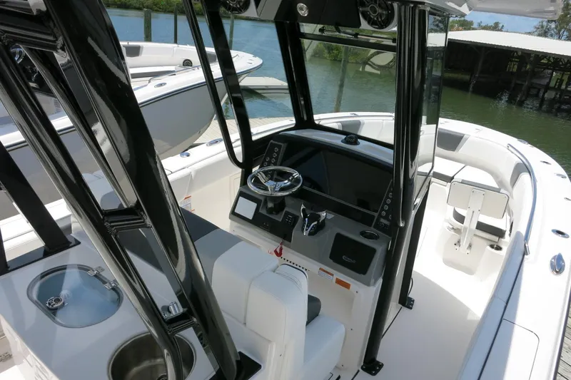 Slide: The Image of 2026 Robalo R270 Center Console boat interior with sleek design and modern controls. - 14