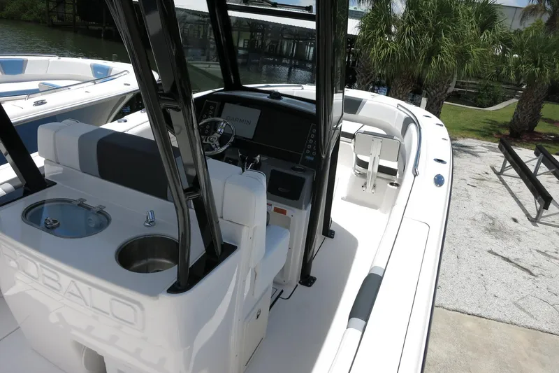 Slide: The Image of 2026 Robalo R270 Center Console boat interior with helm and seating area. - 50