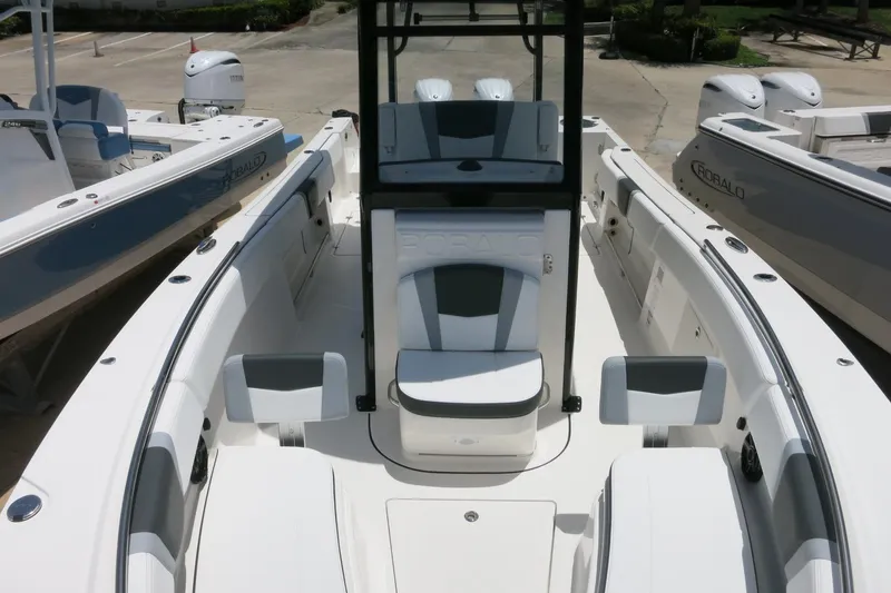 Slide: The Image of 2026 Robalo R270 Center Console boat interior with seating and console view. - 21
