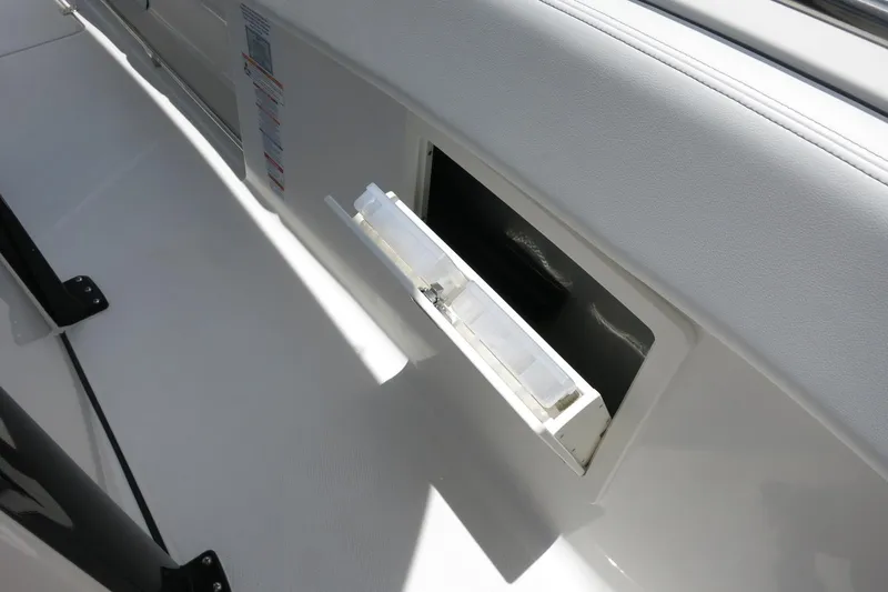 Slide: The Image of 2026 Robalo R270 Center Console boat storage compartment detail. - 67