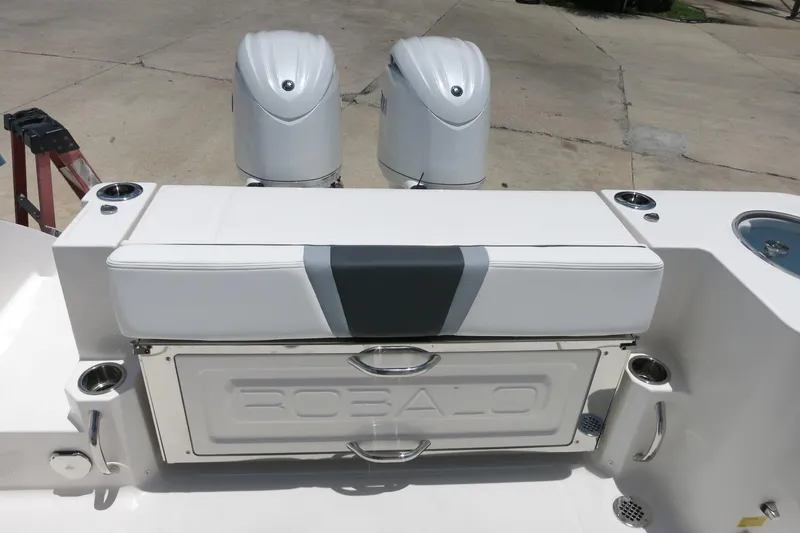 Slide: The Image of 2026 Robalo R270 Center Console boat with dual engines and seating area. - 11